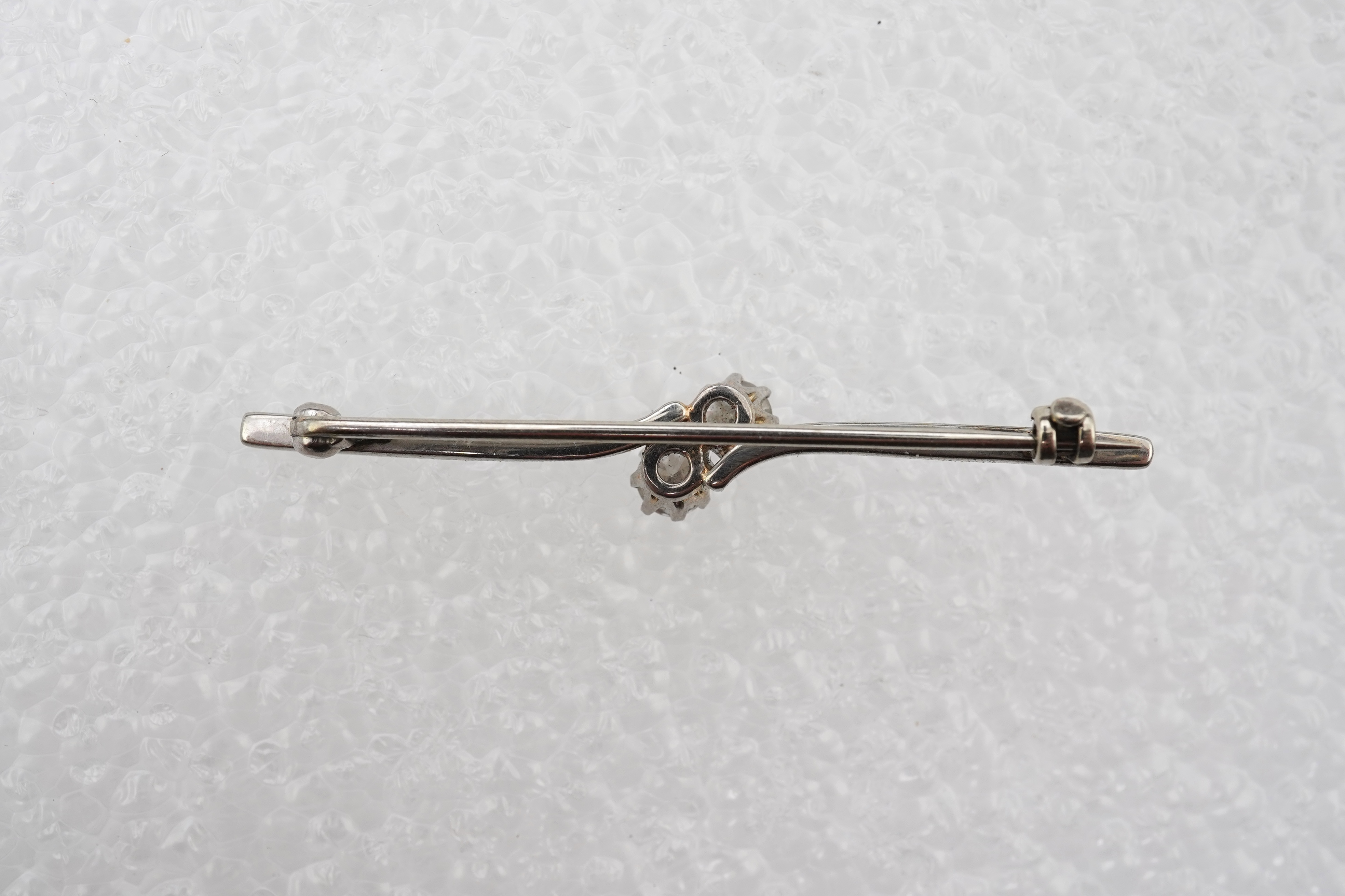 A diamond bar brooch
